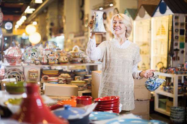 istock Smiling mature female holding  ceramic cookware 823782216