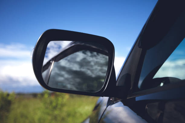 istock Car stopped at green field on summer day 823782636