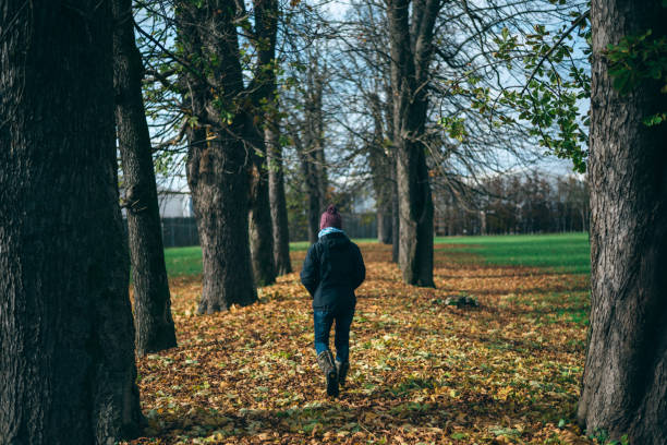 istock Woman walking in the park 823786792