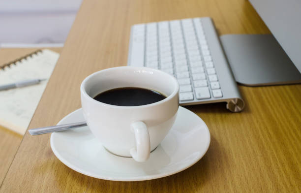 istock Coffee Cup on the Table with Computer Keyboard for Business Concept. 823789510