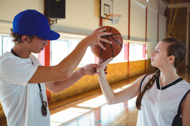 istock Male coach training female basketball player 823789912