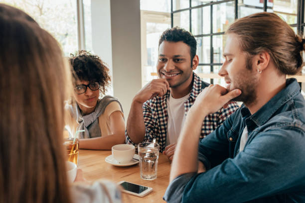 istock Group of young multiethnic friends spending good time together in cafe 823796876