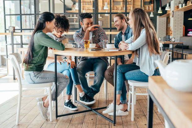 istock Group of young multiethnic friends spending good time together in cafe 823799562