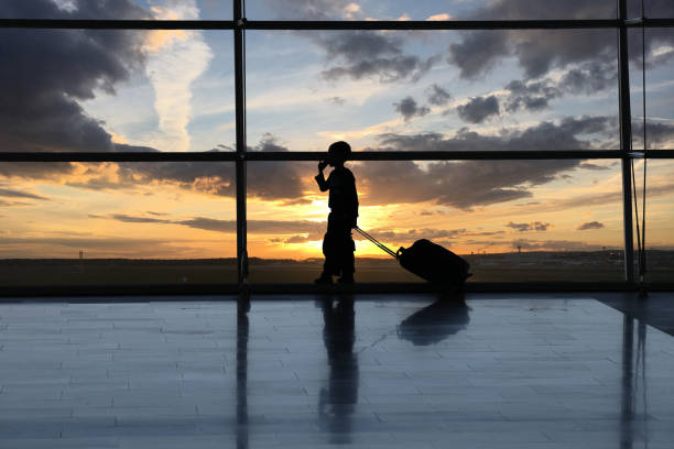 istock Airport interior child travel silhouette 823810824