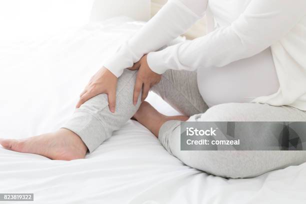 Pregnant Women With Cramp In Leg Stock Photo - Download Image Now - Leg, Pregnant, Women