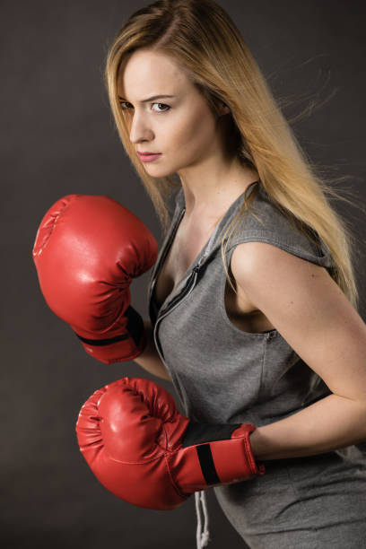 istock Beautiful woman with red boxing gloves 823822176