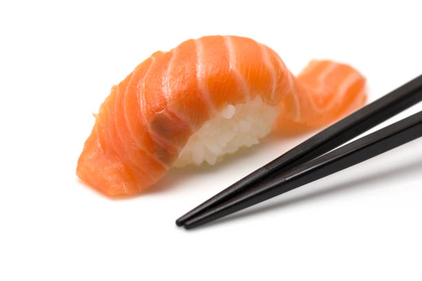 istock Salmon Sushi with chopsticks 823822660