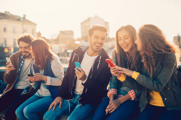 istock Friends texting in the city 823825784