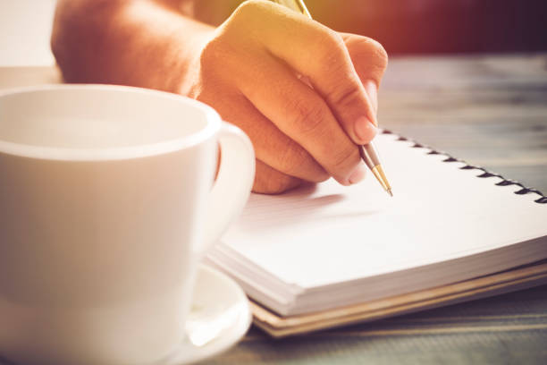istock Writing dairy on notebook in coffee shop, concept as memory of life and education 823826086