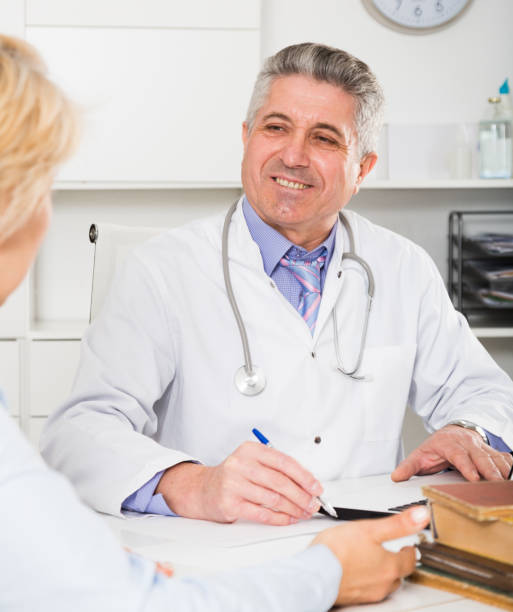 istock Professor of medicine training colleague 823826314