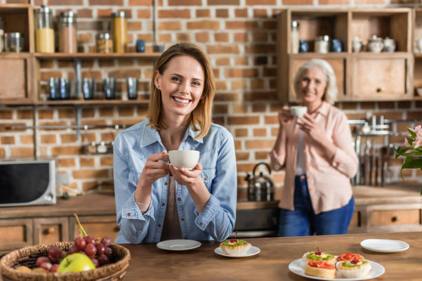 istock two women, senior and young having good time in kitchen 823826374