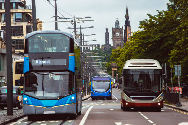 Some modern buses in an urban environment.