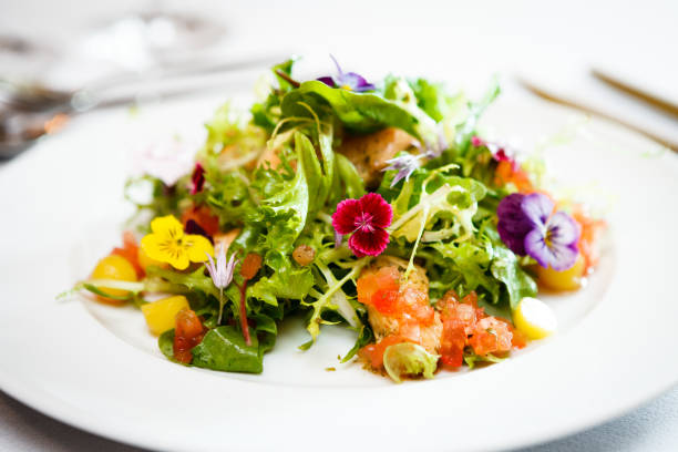 istock Green salad on a white plate 823833058