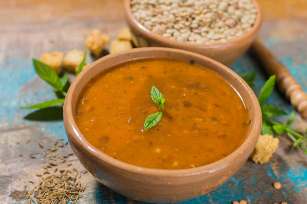 istock Homemade red lentils soup in yellow bowl 823838492