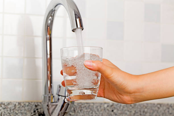 istock Filling glass of water 823838544