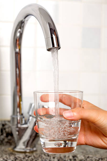 istock Filling glass of water 823838864
