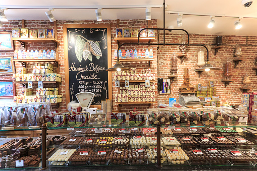 Bruges: Close up of several chocolate sweets in a shop of Bruges