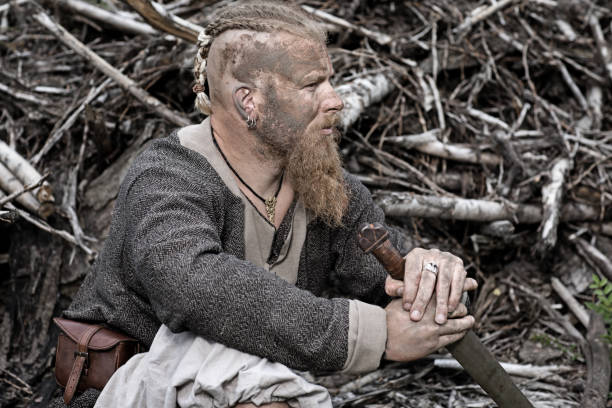 istock Authentic Caucasian Bearded Viking Warrior in Outdoor Forest Setting 823839862