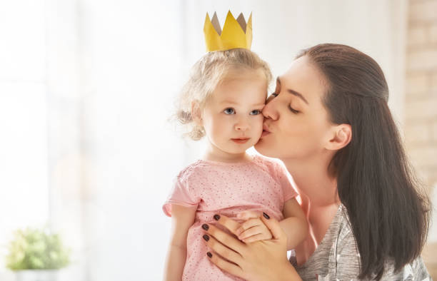 istock Mother and daughter playing and hugging 823839948
