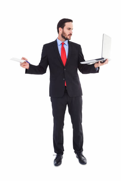istock Handsome businessman holding his laptop 823842772