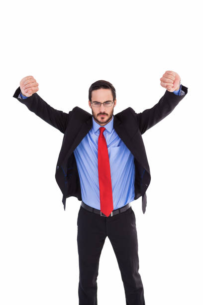 istock Unsmiling businessman standing with arms raised 823845128