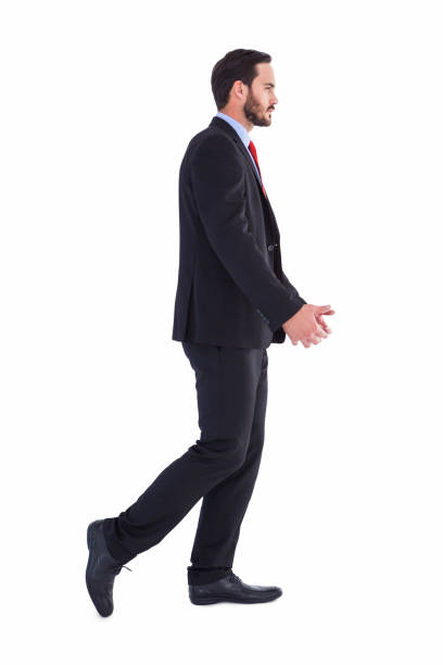 istock Handsome businessman in suit walking away 823845304