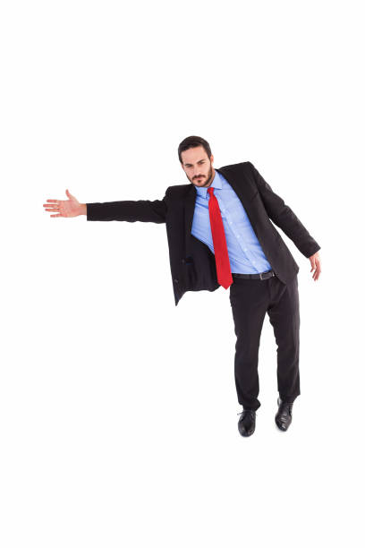 istock Serious businessman in suit gesturing with hand 823845378