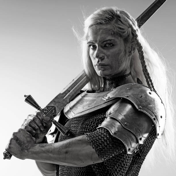istock Sword wielding viking warrior female in studio shot 823846776