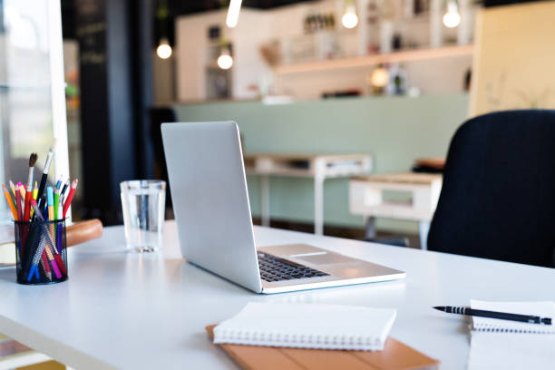 istock Office desk with laptop, notebook, pens and pencils. 823850870