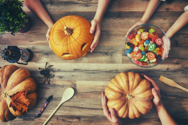istock family prepares for Halloween 823854218