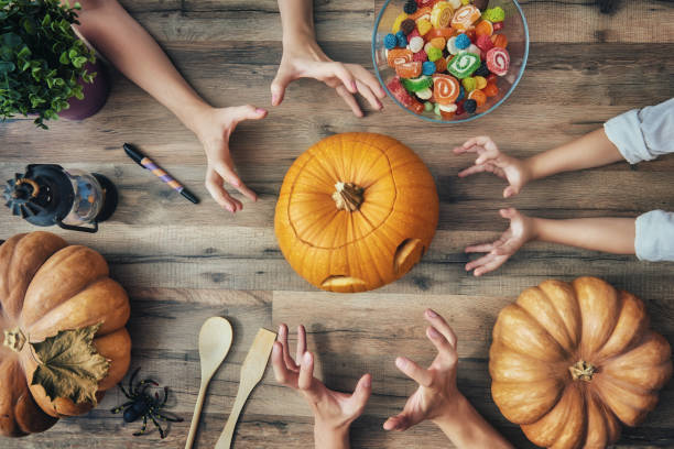 istock family prepares for Halloween 823854340