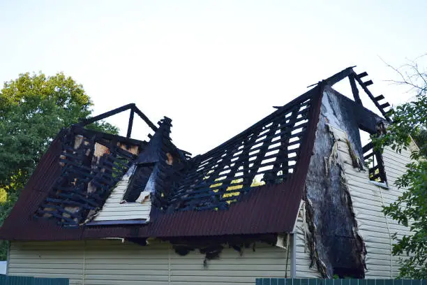 Photo of Damage to the roof from the fire. The house, completed by Siding, suffered from a fire. Fire safety