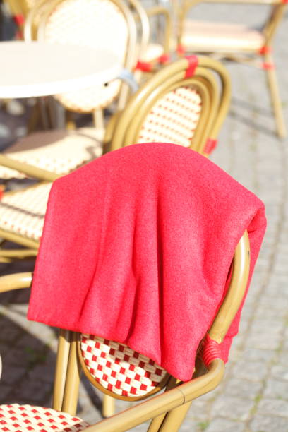 Empty wooden tables at sidewalk cafe in Europe