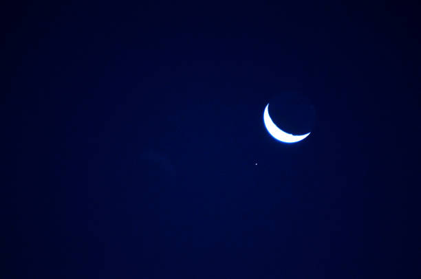 istock White last quarter moon in black sky 823865734