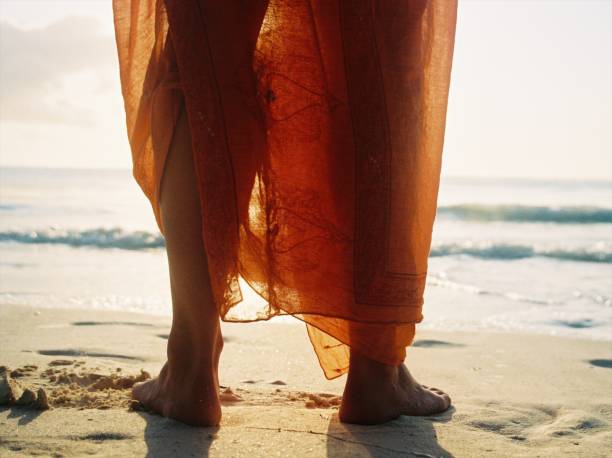 istock Feet and Orange Sarong 823869814