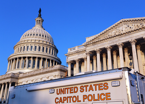 Washington, DC, USA - July 18, 2017: A United States Capitol Police truck parked in front of the US Capitol. The United States Capitol Police is a federal law enforcement agency charged with protecting the United States Congress.