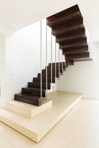 istock Bright minimalist hall with wooden stair 823874318