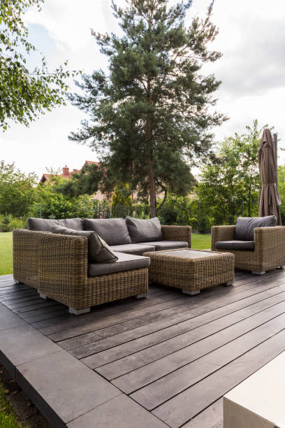 istock Wooden backyard terrace with couch 823874496