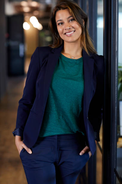istock Confident businesswoman with hands in pockets 823877316