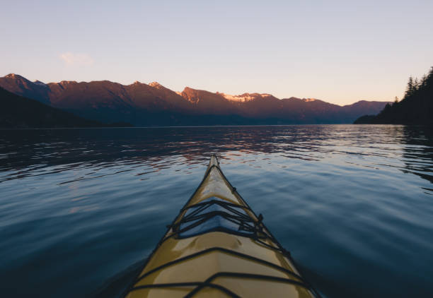 istock Kayaking on lake or sea in the evening while sunset 823884898