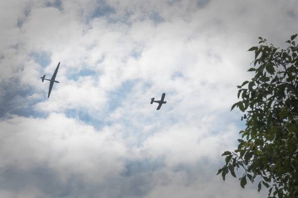 istock a glider hauled by plane over the trees 823890196