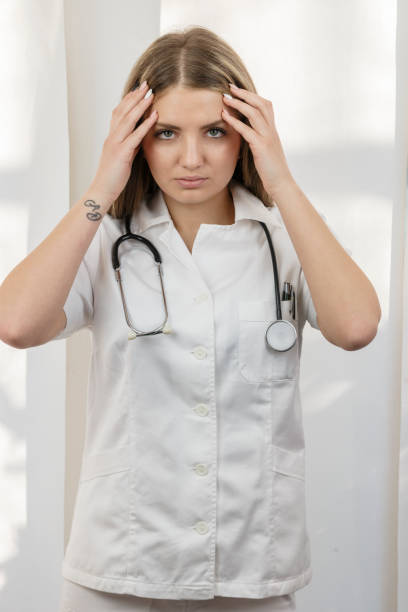 istock Female doctor having a headache. 823890610