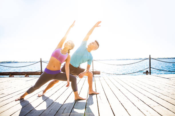 istock Chinese couple having yoga class outdoor 823891292