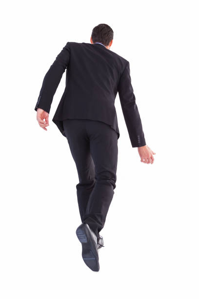 istock Rear view of businessman walking 823895030