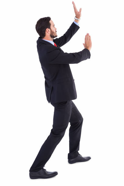 istock Businessman standing and pushing up 823897464