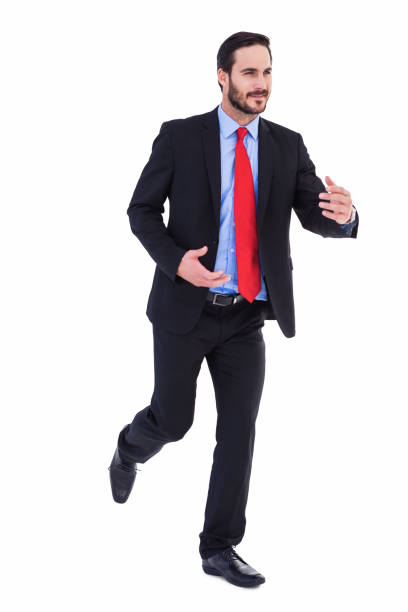 istock Smiling young businessman in suit running 823897536