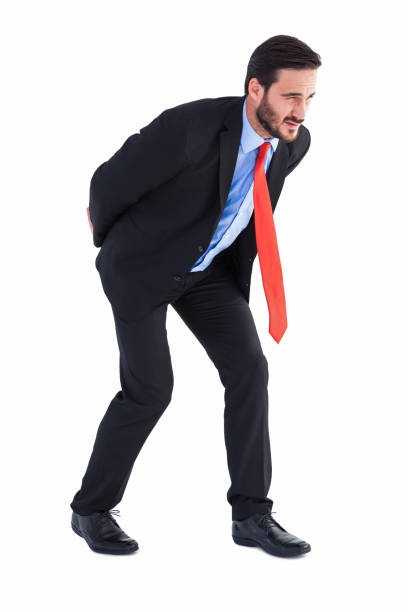 istock Businessman in suit carrying something heavy 823898426