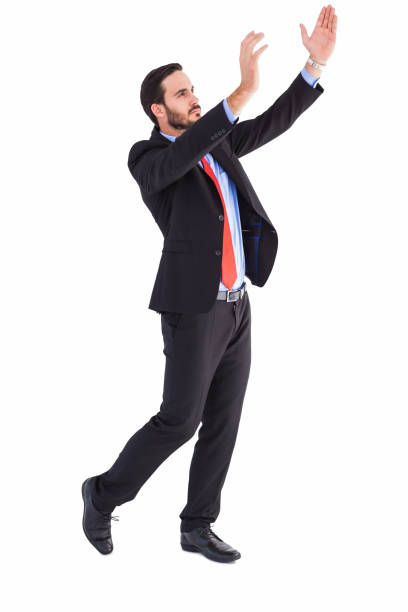 istock Serious businessman holding up with his hands 823898712