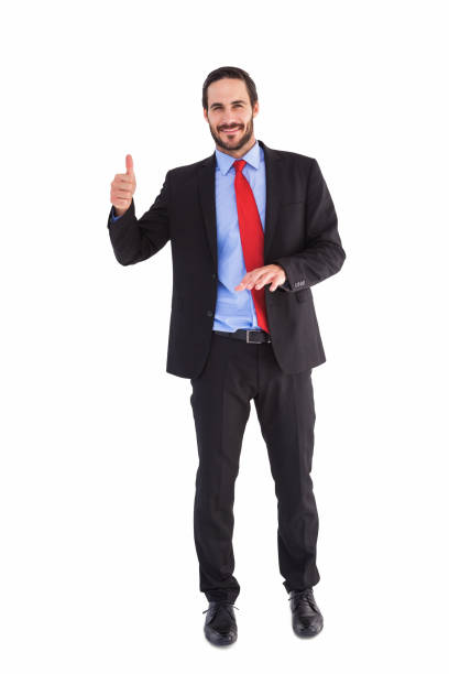 istock Smiling businessman giving thumbs up 823899036