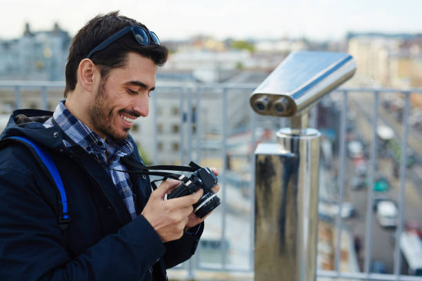istock Young Photographer on Rooftop Viewing Platform 823902546